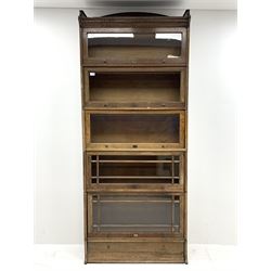 Early 20th century oak stacking library bookcase, five graduating sections with hinged and sliding glazed doors, single drawer to base, W89cm, H219cm, D35cm