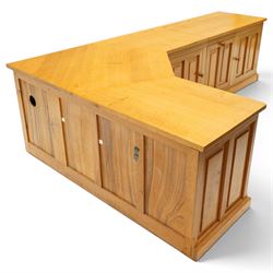 Seahorseman by Shaw & Riley - bespoke large Yorkshire oak corner sideboard or media unit, of L-shape form, with three cupboard doors, a fall front drawer over a regular drawer, a lift up panel for a record player, multiple apertures for wires, raised on a plinth base, with signature Seahorse carving from the workshop of A. Shaw & Riley Ltd, Hessay