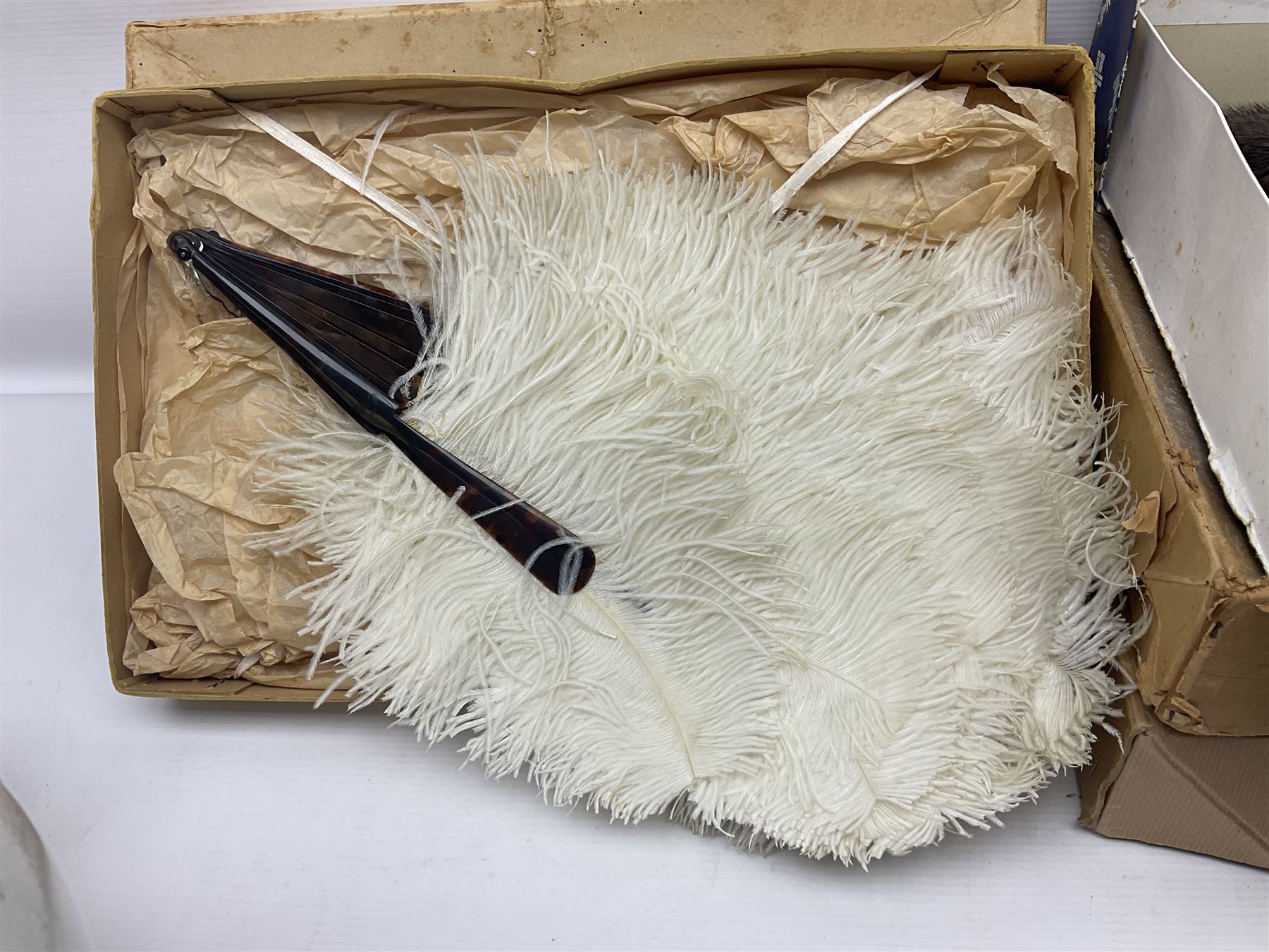 White Ostrich feather fan, together with ceramic head, leather bound photo book, Wedgwood chamber pot and other collectables 