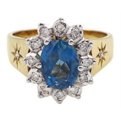 9ct gold oval blue topaz and round brilliant cut diamond cluster ring, with gypsy set diamond shoulders, Birmingham 1987 