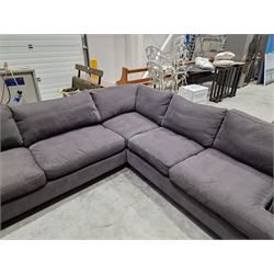 Large corner sofa upholstered in grey fabric 
