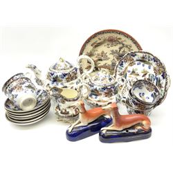 A pair of Victorian Staffordshire pen holders modelled as recumbent greyhounds, together with Victorian tea wares with chinoiserie style decoration, comprising teapot, twin handled lidded sucrier, milk jug, cake plate, six teacups and six saucers, plus a further chinoiserie decoration plate. 
