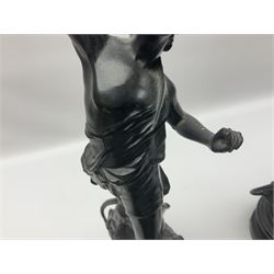 Pair of spelter figures, Le Force and Le Pouvoir, modeled as figures standing on lions, arms held aloft, H51cm 