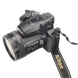Nikon Coolpix P900 digital camera serial no. 40116983, with a Nikkor 83x wide optical zoom ED VR 4.3-357mm 1:2.8-6.5 lens, boxed with strap, Cobra case, dual and single chargers and three batteries