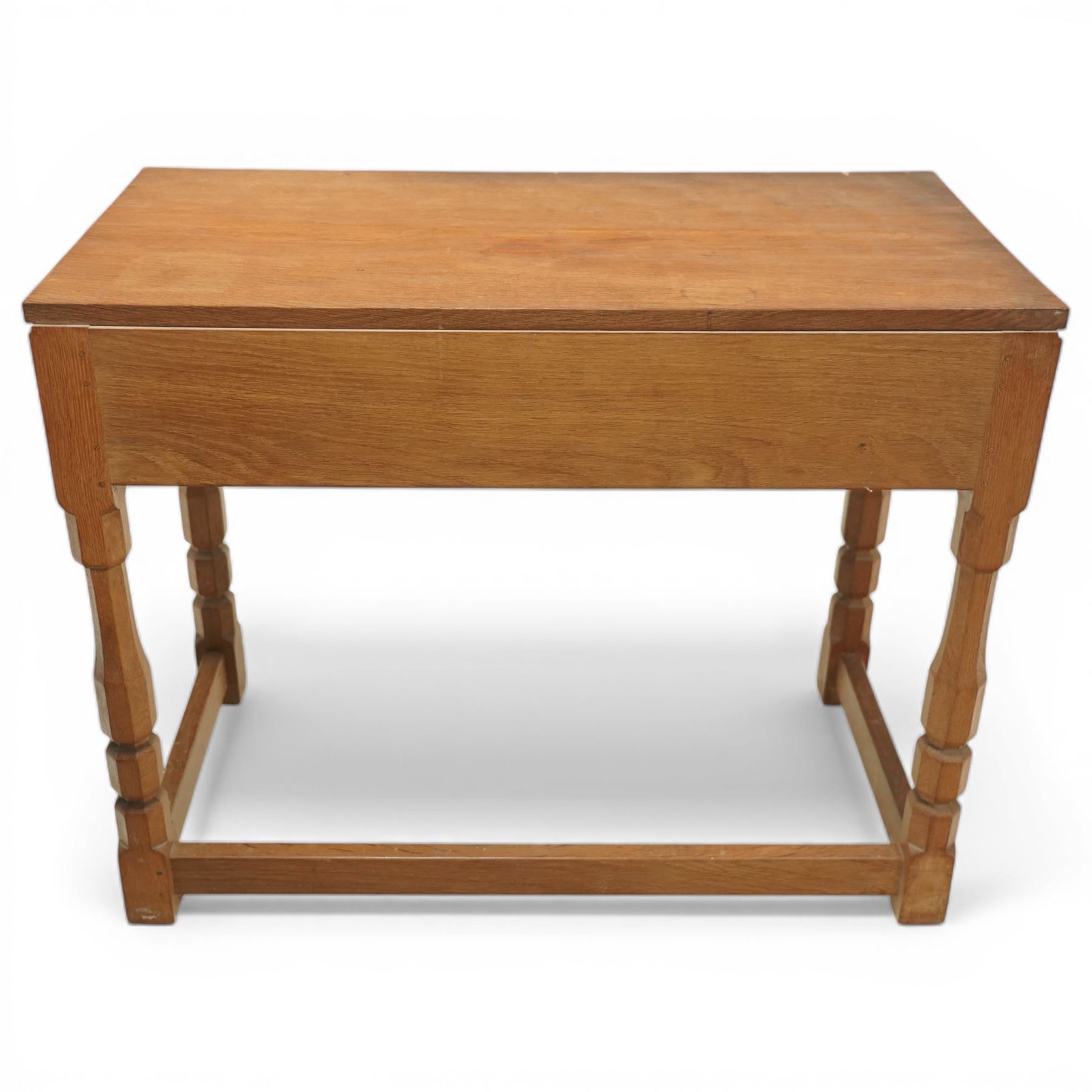 Mouseman - oak side table, rectangular adzed top, fitted with two drawers with turned wooden knobs, raised on octagonal supports, with carved mouse  signature, by the workshop of Robert Thompson of Kilburn