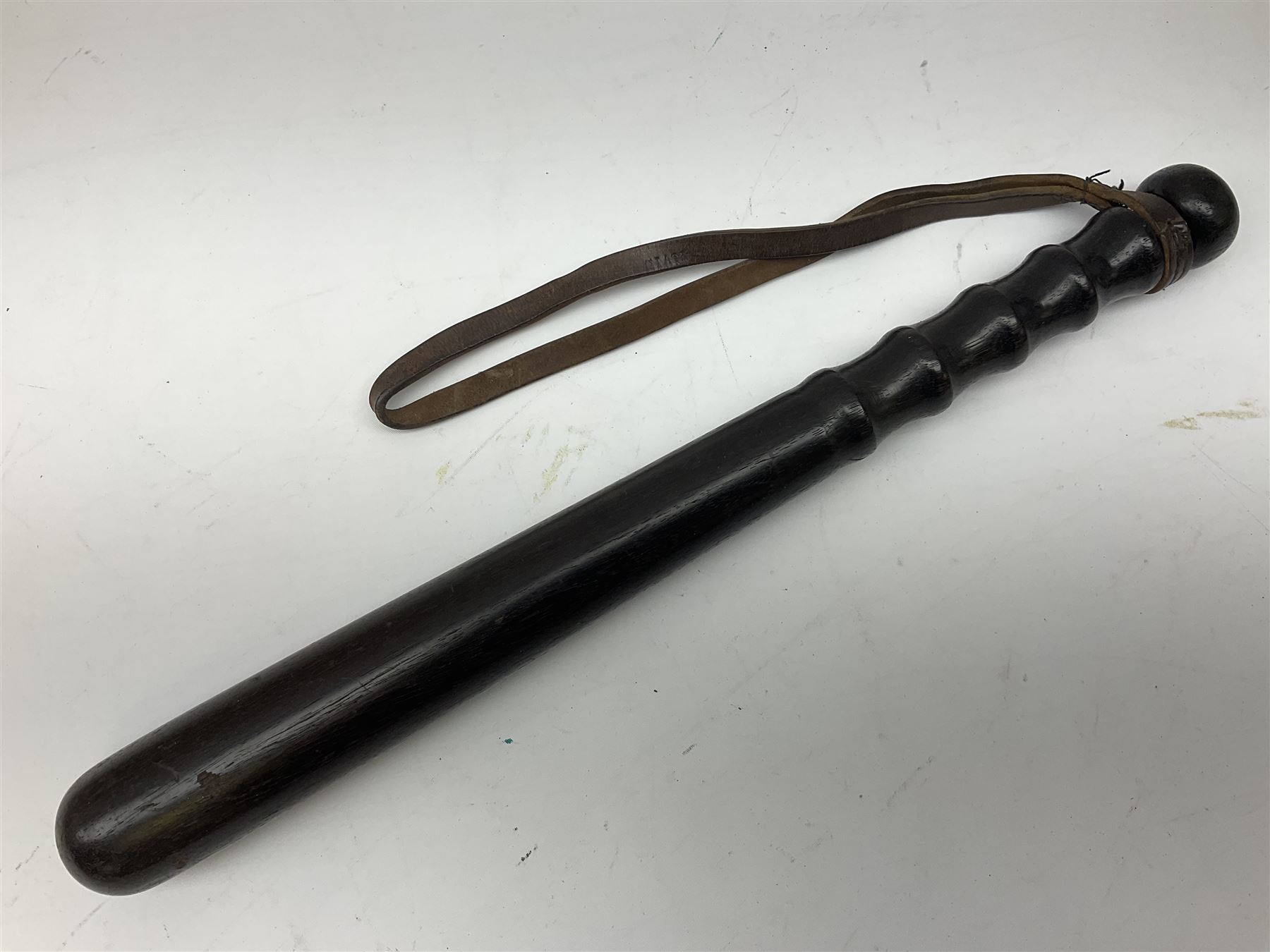 British Transport Police Custodian helmet with Queen's Crown plate; Hiatt & Co ebonised hardwood patrol truncheon; and pair of Hiatts 1960 hand-cuffs (3)
