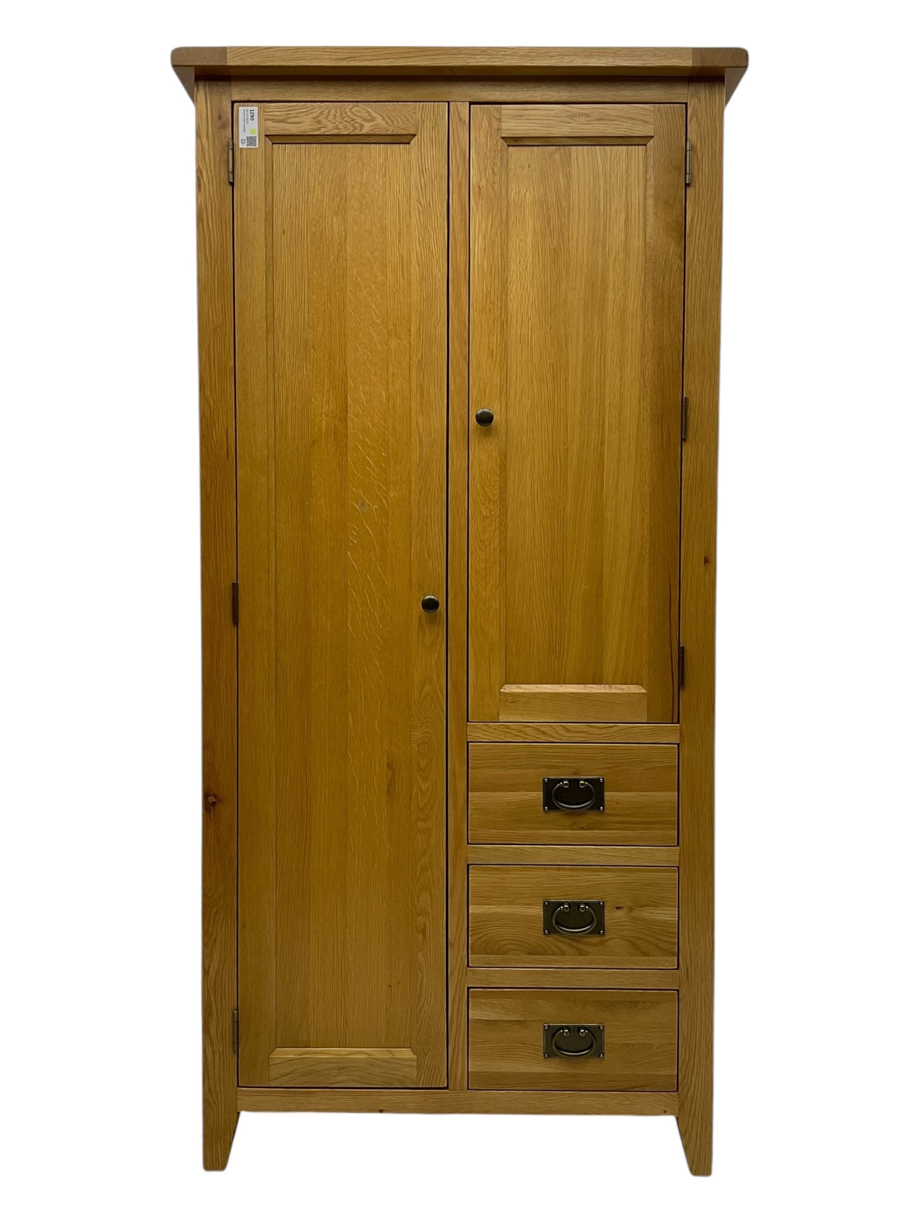 Light oak combination wardrobe, fitted with full-height compartment, single cupboard and three small drawers