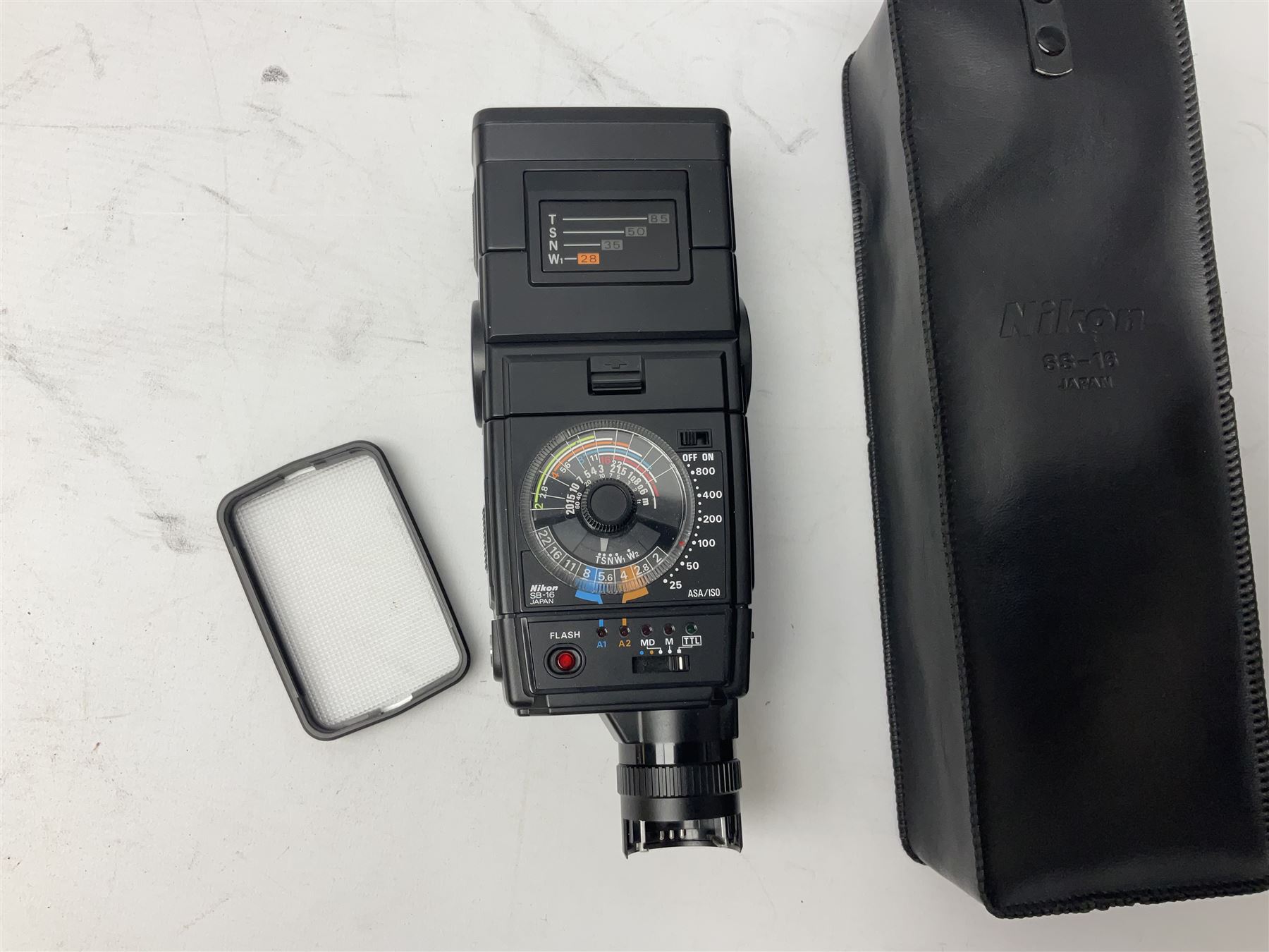 Nikon F3 SLR camera, serial number 1583609; Nikon 50mm 1:1.8 lens; Nikon 28-85mm 1:3.5-4.5 zoom lens; Vivitar MC 2X-3 Tele Converter, and a Nikon Speedlight SB-16 flash