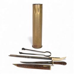 Artillery shell case, together with fireside tools and carved wooden dagger 