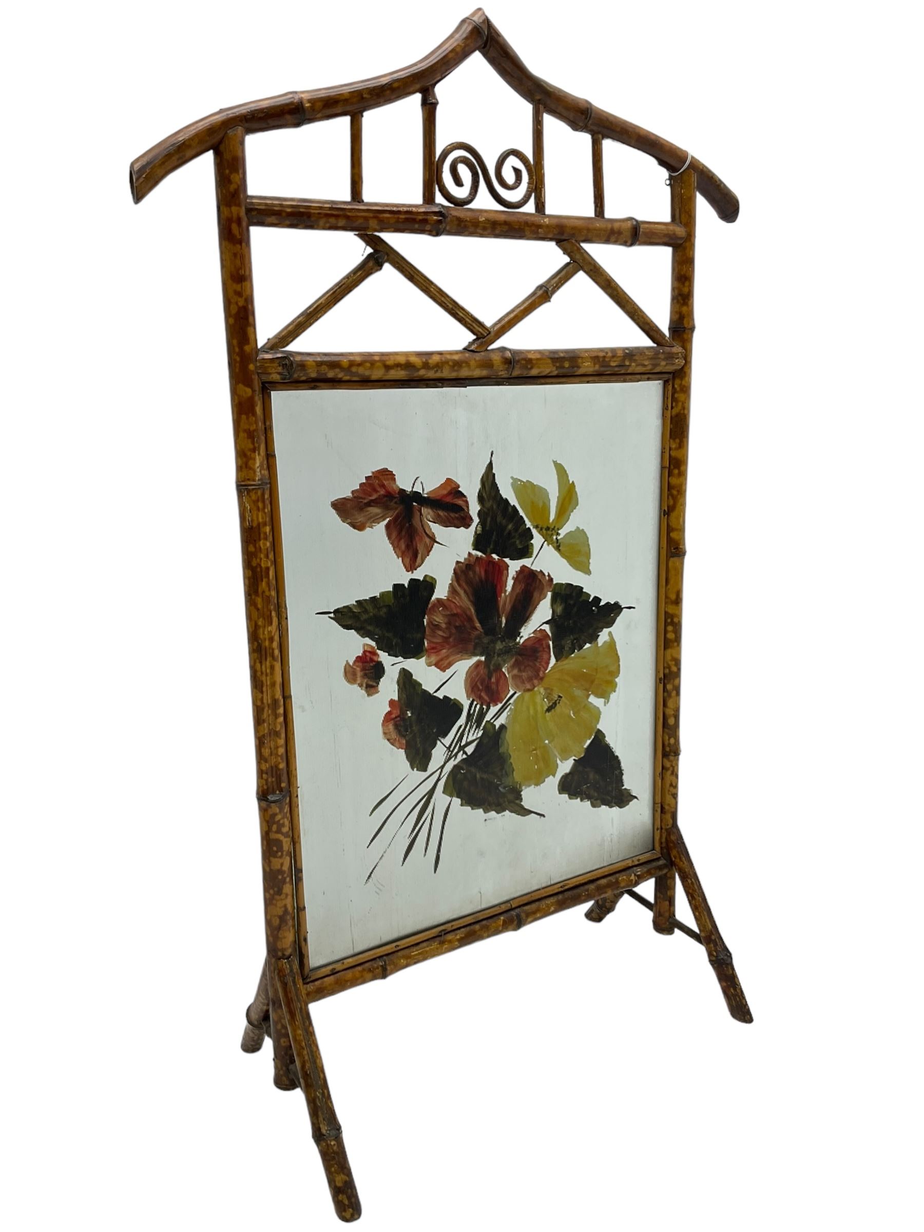Victorian bamboo fire screen, pointed arched cresting rails over floral painted glass panel 
