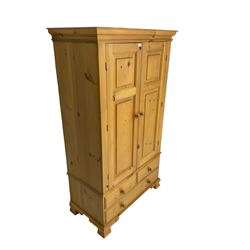 Pine double wardrobe, moulded cornice, fitted with two panelled doors over three drawers, on ogee feet