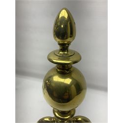Pair of early 20th century brass fire dogs, each with sphere and urn finial, upon a scrolling base, H38cm