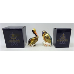  Two Royal Crown Derby paperweights, 'kingfisher' and 'brown pelican', boxed, with gold stoppers  