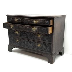 19th century heavily carved oak chest of drawers, two short and three long graduating drawers, oggy supports