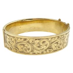 9ct gold hinged bangle with bright cut decoration by Henry Griffith & Sons Ltd, Birmingham