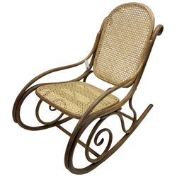 Early 20th century Michael Thonet design bentwood rocking chair, with cane seat and back (W52cm H82cm); Edwardian rocking chair with mauve upholstered back and seat (W43cm H70cm)