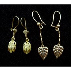 Pair of leaf design gold earrings and pair of gold beetle pendant earrings, both 18ct stamped or tested