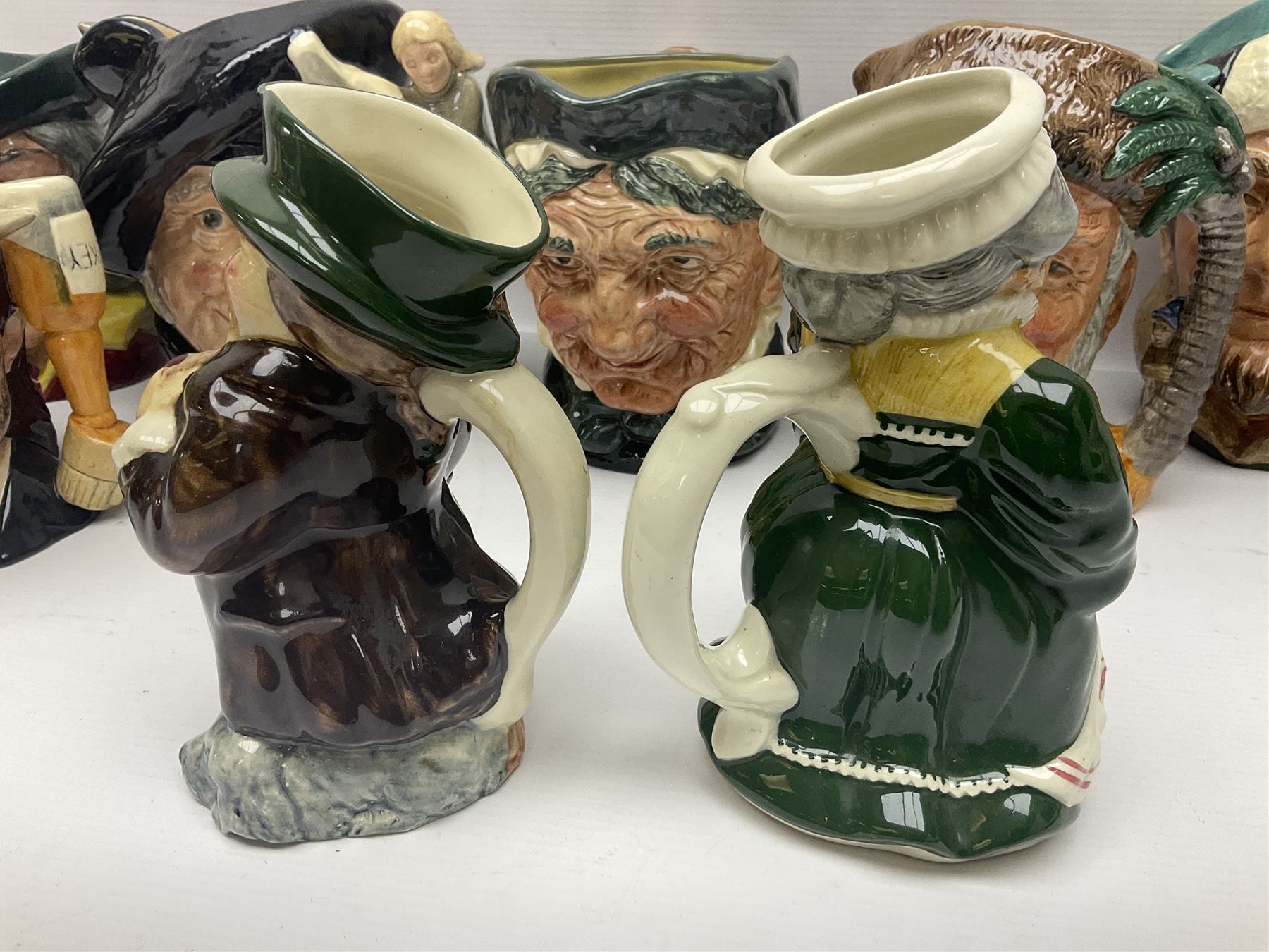Large collection of Royal Doulton character jugs, to include Robinson Crusoe D6532, Tam O Shanter D6632, The Falconer D6533 etc, together with similar charater jugs and toby jugs   