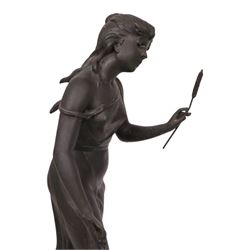 French green onyx clock, surmounted by a female figure amongst rushes, the enamel clock face with floral sprigs, H74cm 