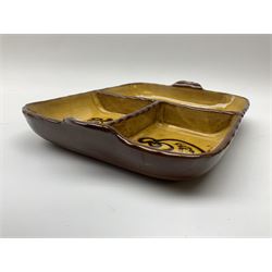 A Peter Holdsworth Ramsbury slipware dish, of rounded oblong with twin handled and three divisions, decorated to each division with stylised fish, L28cm.