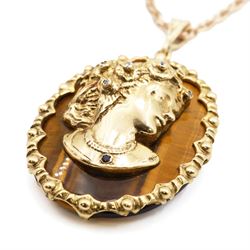 9ct gold tiger's eye diamond and sapphire portrait pendant necklace, oval cut tiger's eye, with applied bust of a lady in profile, her hair set with diamonds and necklace set with a sapphire, within a scalloped design frame, on a fancy twist chain necklace, both hallmarked