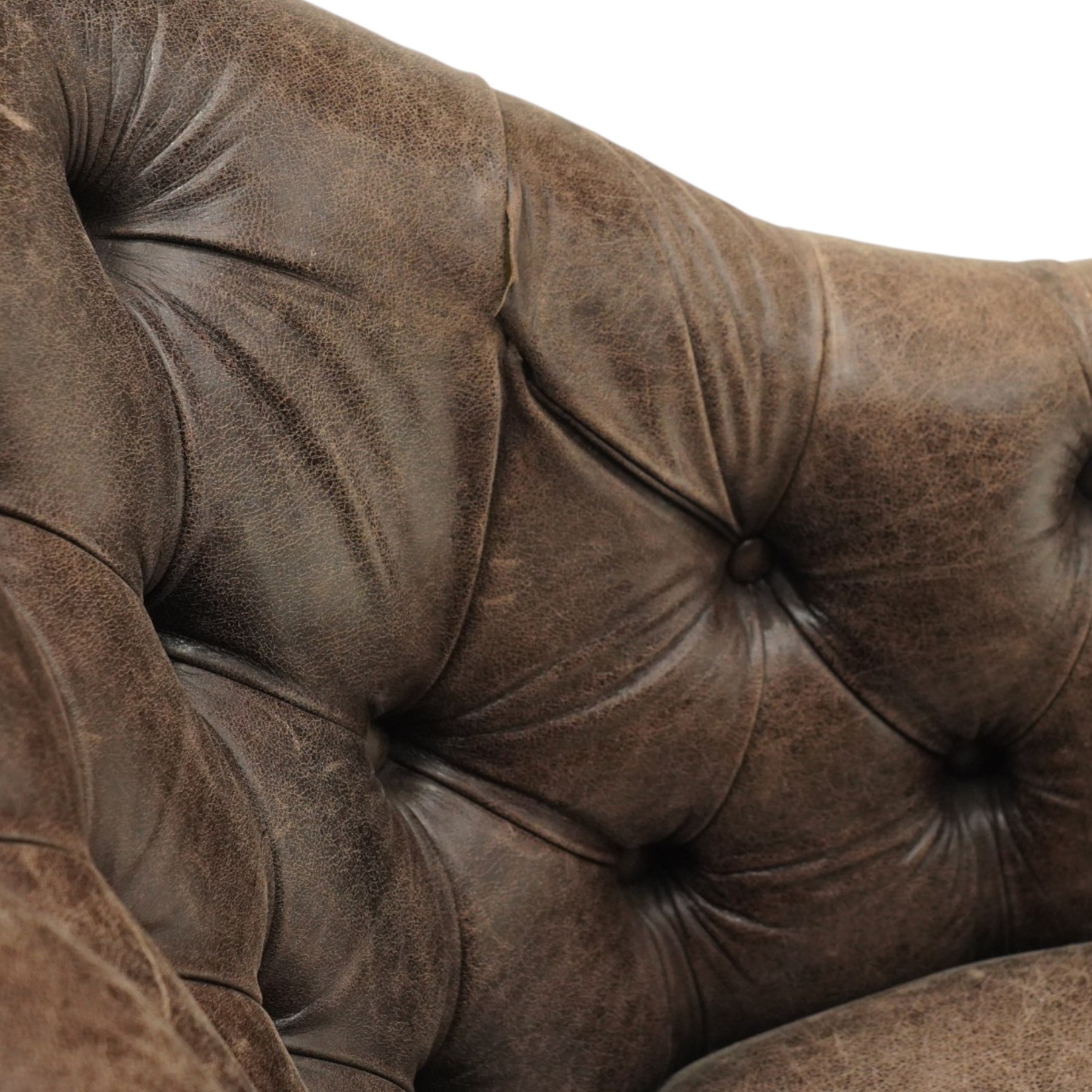 Georgian design tub-shaped club armchair, upholstered in back-buttoned dark tan leather with sprung seat, raised on square tapering supports with brass cups and castors