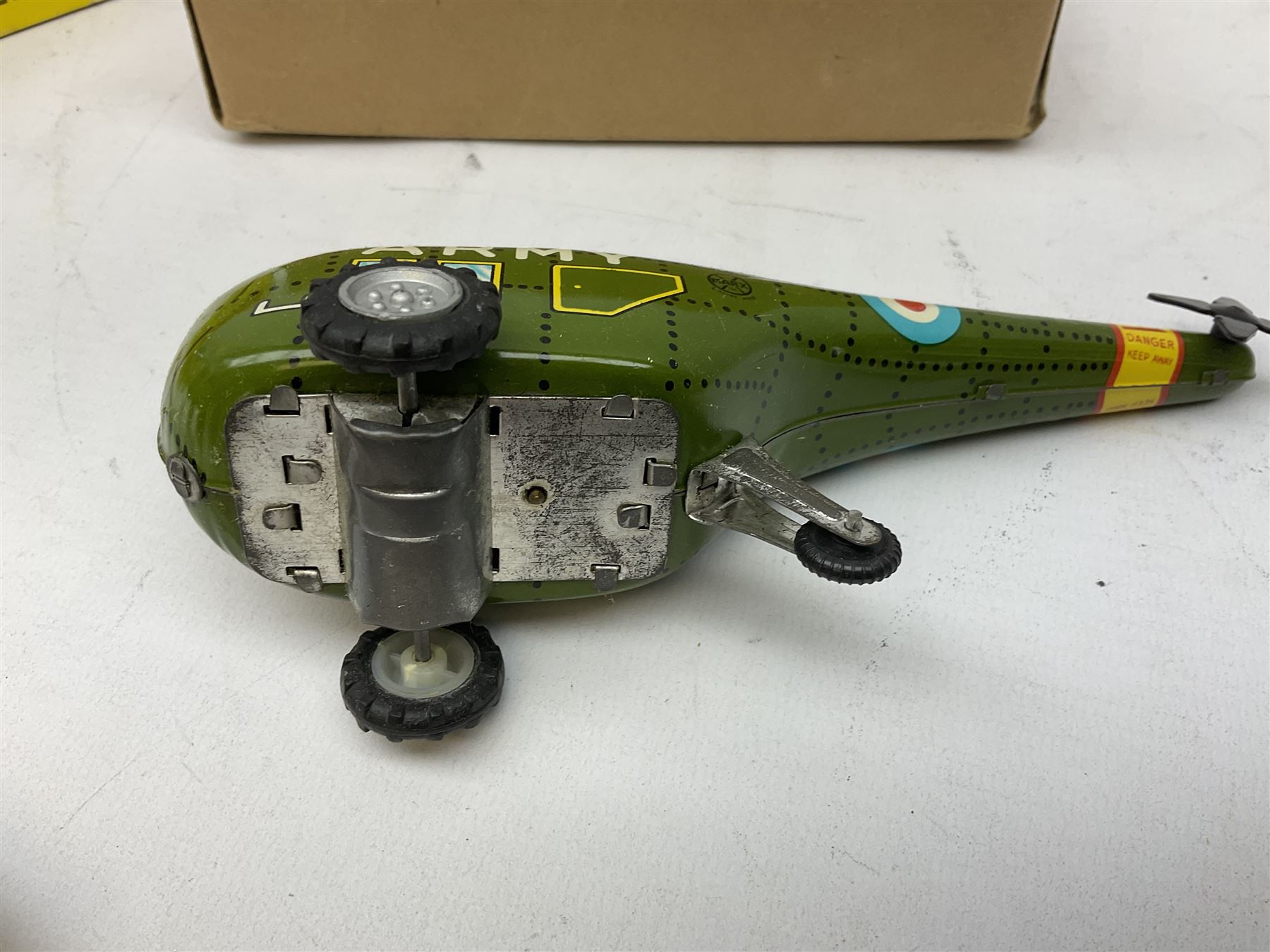 Various makers - Tri-ang Mini-Hi-Way Racing Car Series Le Mans No.9 racing car; Matchbox K-15 Merryweather Fire-Engine; Marx tin-plate Friction Helicopter; all boxed; and a Minic Motor Rally Adventure box containing a Jaguar Police car for spares or repair (4)