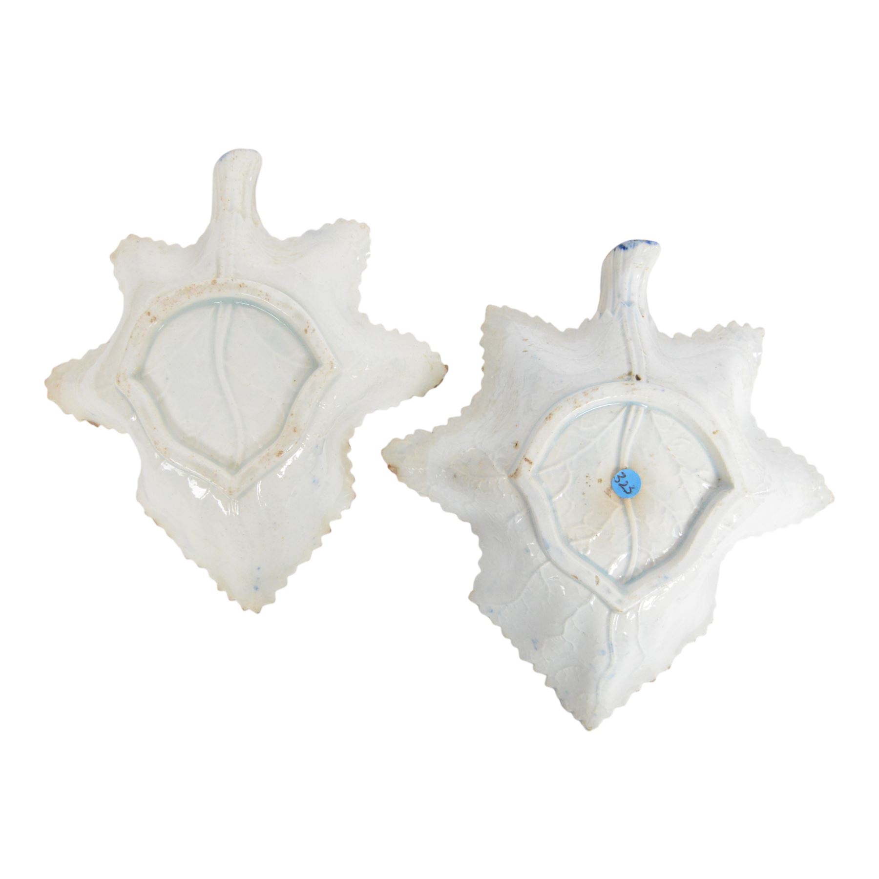 Two early 19th century leaf shape pickle dish, each blue and white transfer printed, the first example decorated in the Queen of Sheba or Chinese Procession pattern, L14cm, the second decorated in a similar pattern with figures under a parasol before a pagoda, L15cm