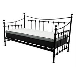 Contemporary Victorian revival black metal day bed, featuring arched back and sides with turned finials and spindle rails, complete with single 'OTTO' mattress
