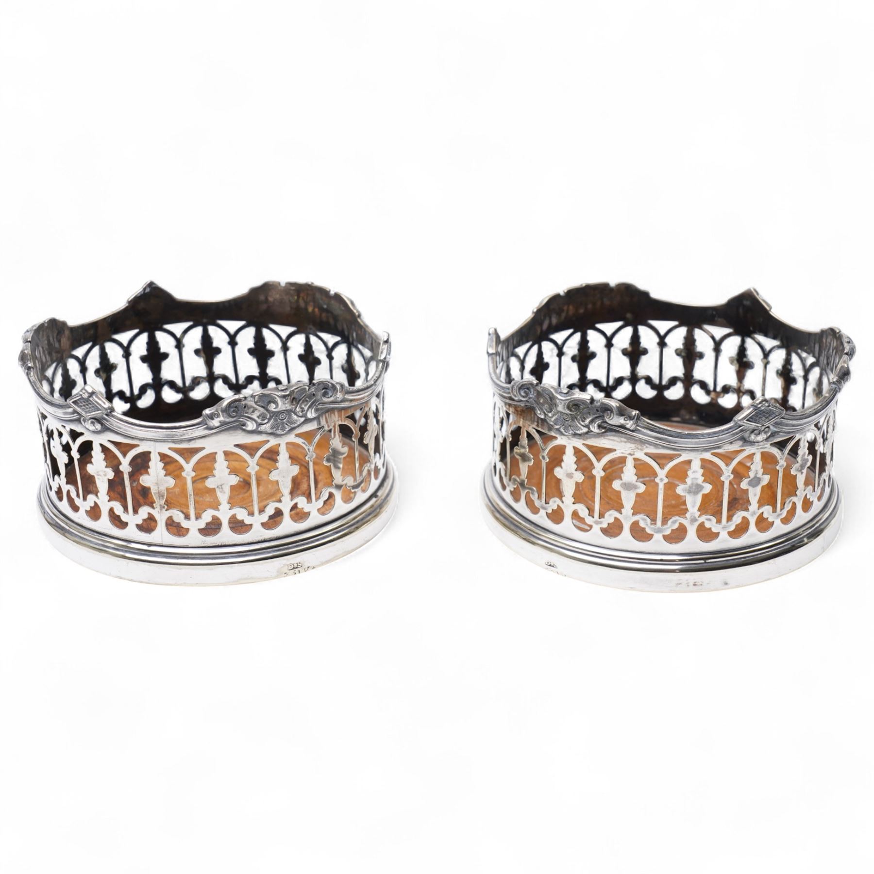  Pair of Victorian plated bottle coasters with pierced sides and turned boxwood bases