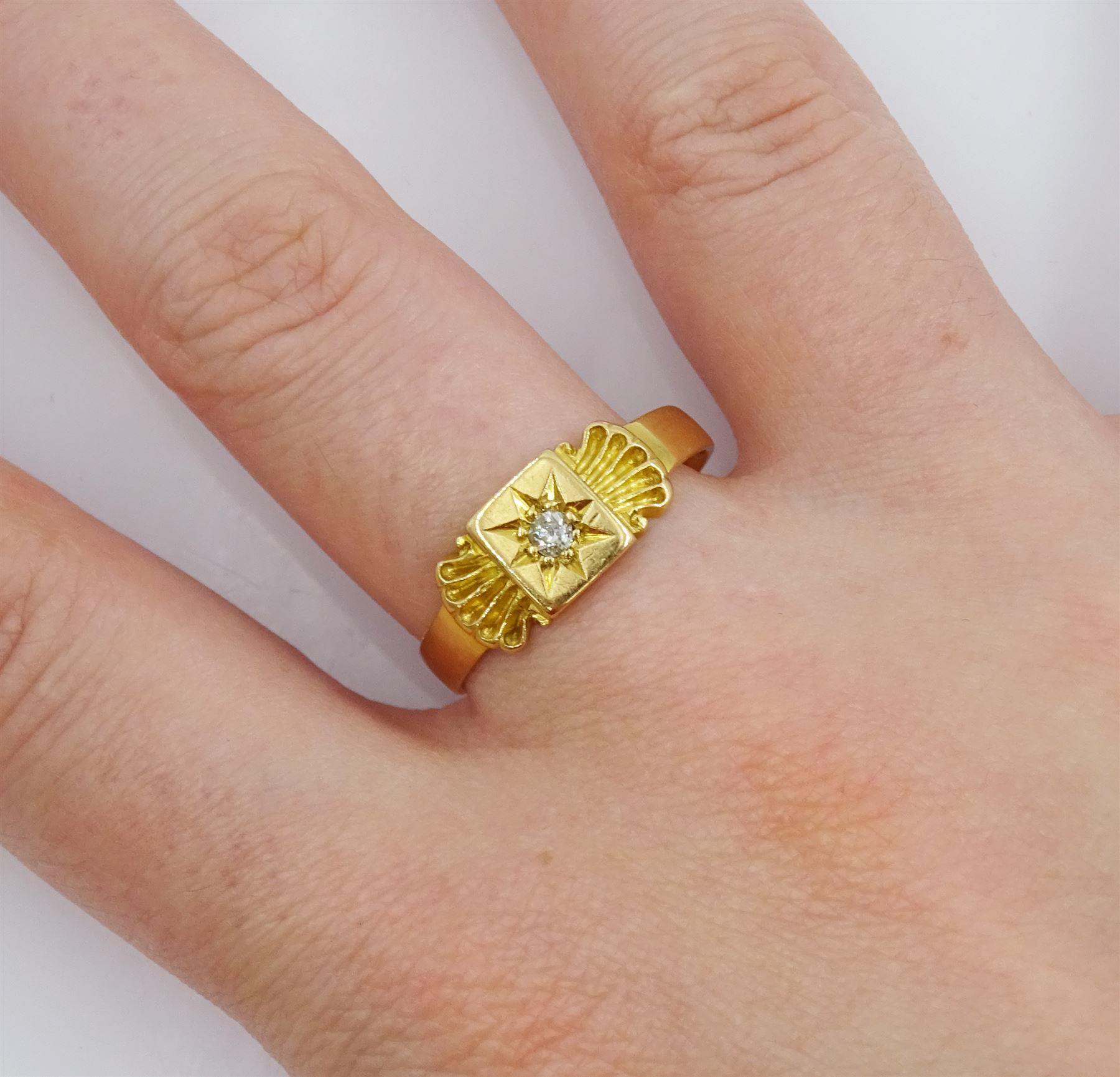 Victorian 18ct gold single stone diamond ring, the central star set old cut diamond with a scallop shell detail either side, Chester 1898