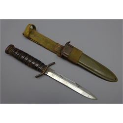  WW2 American M3 Combat knife 16.6cm single edged blade stamped US M3-UC-1943, leather washer ribbed grip with turn down crossguard and steel pommel with flaming grenade stamp, L29cm, in scabbard with mount marked US M8 BM Co  