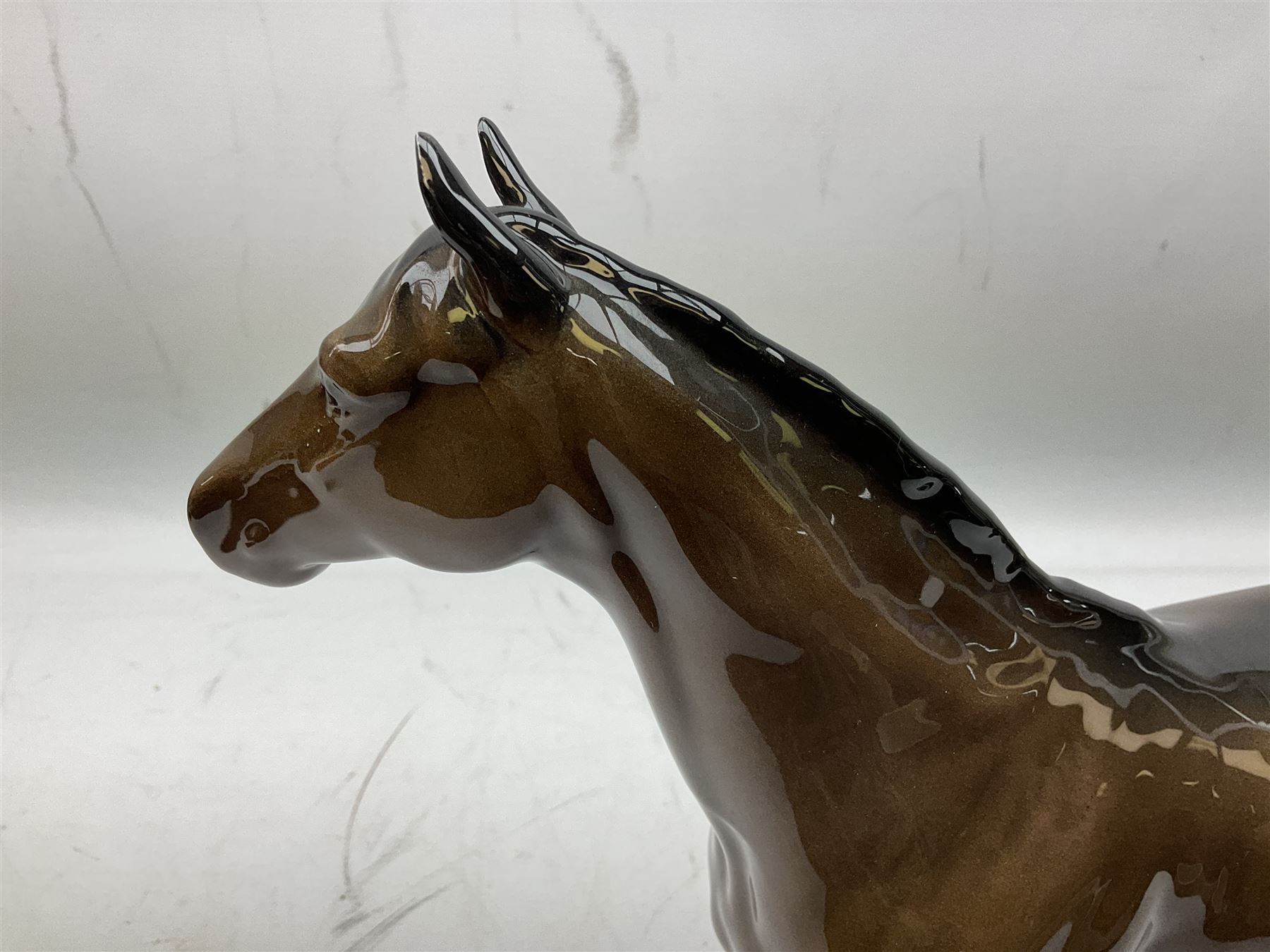 Six Beswick figures of bay horses, including large hunter no.1734, Shire horse no.818, horse with tucked head no.1549, etc (6)