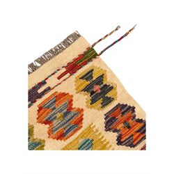 Chobi Kilim flatweave rug, cream ground with a multicoloured geometric diamond field, framed by a bold border of repeating stylised motifs, finished with braided corner tassels
