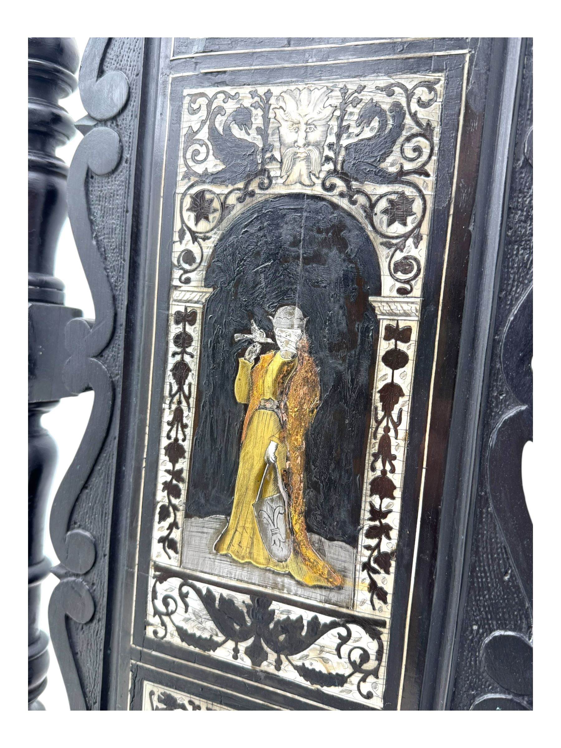 19th century Italian ebonised side chair, the backrest inlaid with bone and decorated with a painted figure in Renaissance dress within an arched reserve, flanked by turned supports and scrolled cresting, the seat and frieze similarly inlaid, raised on turned legs with shaped stretchers