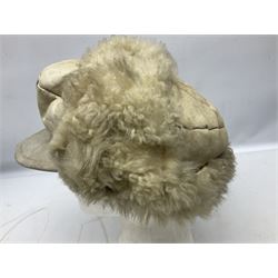 WW2 German Luftwaffe winter or Eastern Front fur cap with fold-down ear covers; cloth eagle and roundel insignias; bears label numbered 82920 with other indistinct markings