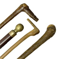 Four wooden walking canes, including a c
