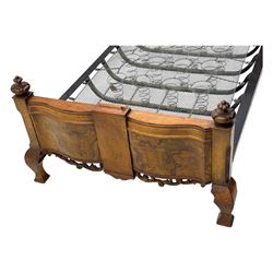 Mid-20th century walnut single bedstead, high shaped headboard, footboard with turned finials and scrollwork carvings, complete with 'Vono' iron frame, raised on cabriole supports