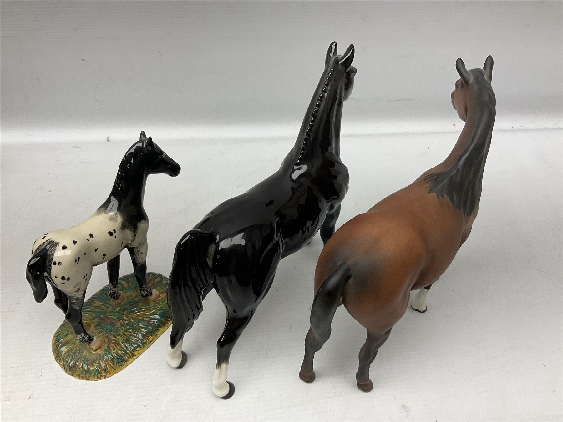 Collection of Beswick horse figures, to include Red Rum on a wooden plinth,  Lammtarra on oval plinth, Morgan Horse Black and three others, together with Royal Daulton Appaloosa Foal and a USSR horse