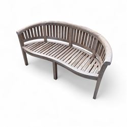 Teak serpentine garden bench