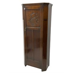 Early to mid-20th century oak hall wardrobe, the panelled door decorated in relief with sailing scene carving
