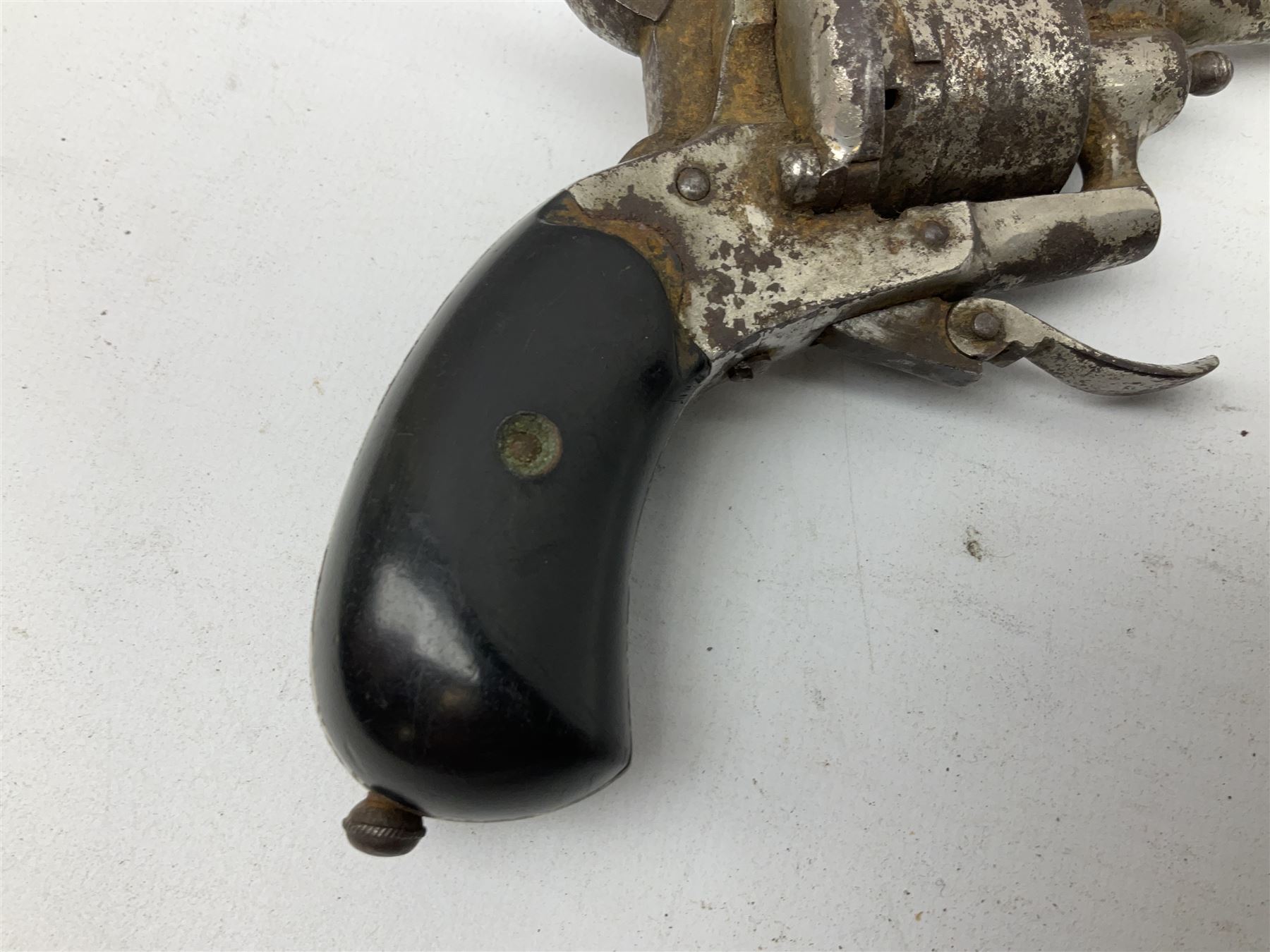 19th century 7mm six-shot pin-fire revolver, with folding trigger, two-piece ebonised grip and ejector rod in butt L17cm