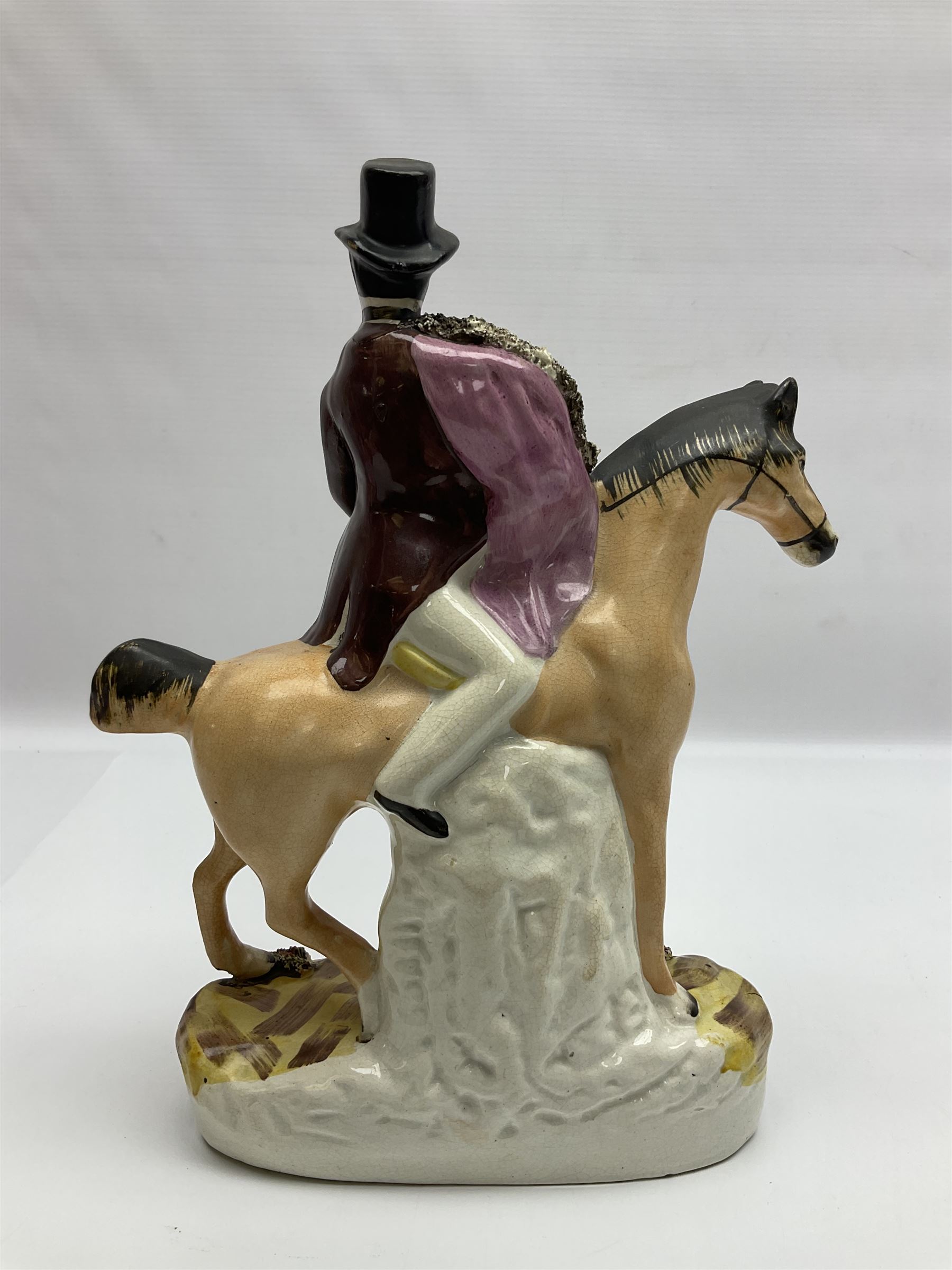 19th century Staffordshire figure of Robert Peel, titled 'Sir Robert Peel', modelled on horseback, atop an oval plinth base featuring a naturalistic and floral design, H30cm 