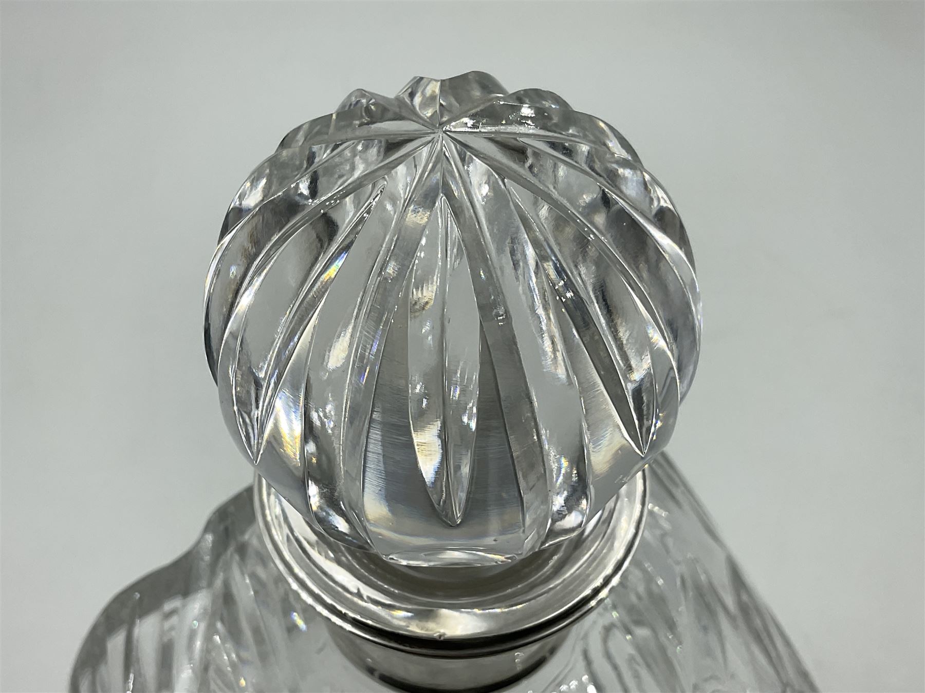Modern silver mounted glass decanter, the cut glass body of circular form, with personal engraving, the silver collar hallmarked L J Millington, Birmingham 2008, overall H23.5cm