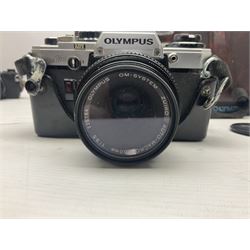 Olympus OM-2 camera body, serial no 1117526, with Olympus OM-System Zuiko Auto-W 28mm 1:2.8'  lens serial no 336591, Olympus OM10 camera body serial no 2392257, with Olympus OM-System Zuiko Auto-Macro 50mm 1:3.5' lens serial no 225784, Soligor C/D mirror lens 1:8 f=500mm' serial no 784035650 together with other camera equipment 