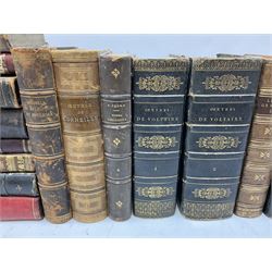 Eighteen 19th century leather bound books including Oeuvres Completes De Voltaire. 1827 Paris. Two volumes; Oeuvres De Pierre Corneille. 1892 Paris; Commentarium in Librum Geneseos Scripsit Thomas Josephus Lamy. 1883 Mechliniae; etc (18)