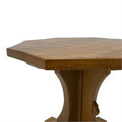 Mouseman - oak occasional table, octagonal adzed top on cruciform base with sledge feet, carved with mouse signature, by the workshop of Robert Thompson, Kilburn 