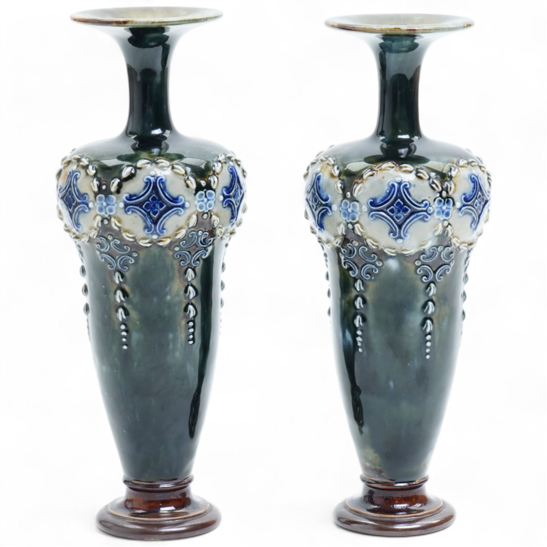 Pair of Royal Doulton stoneware vases, of baluster form with bulbous neck, with trailing white flowers and blue panel decoration, impressed mark and signature to base, 26cm (2)