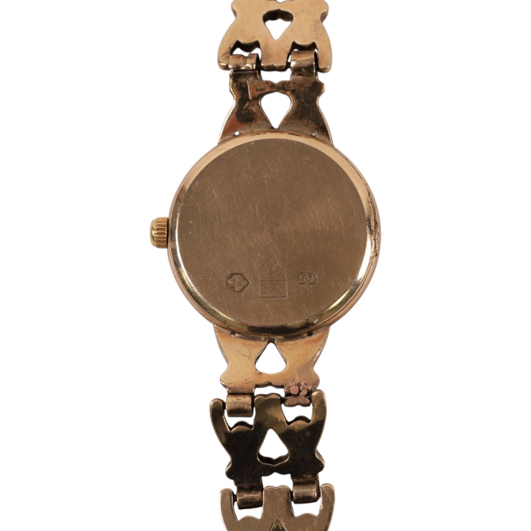 Accurist ladies 9ct gold quartz wristwatch, mother of pearl dial, on integral 9ct gold bracelet, hallmarked