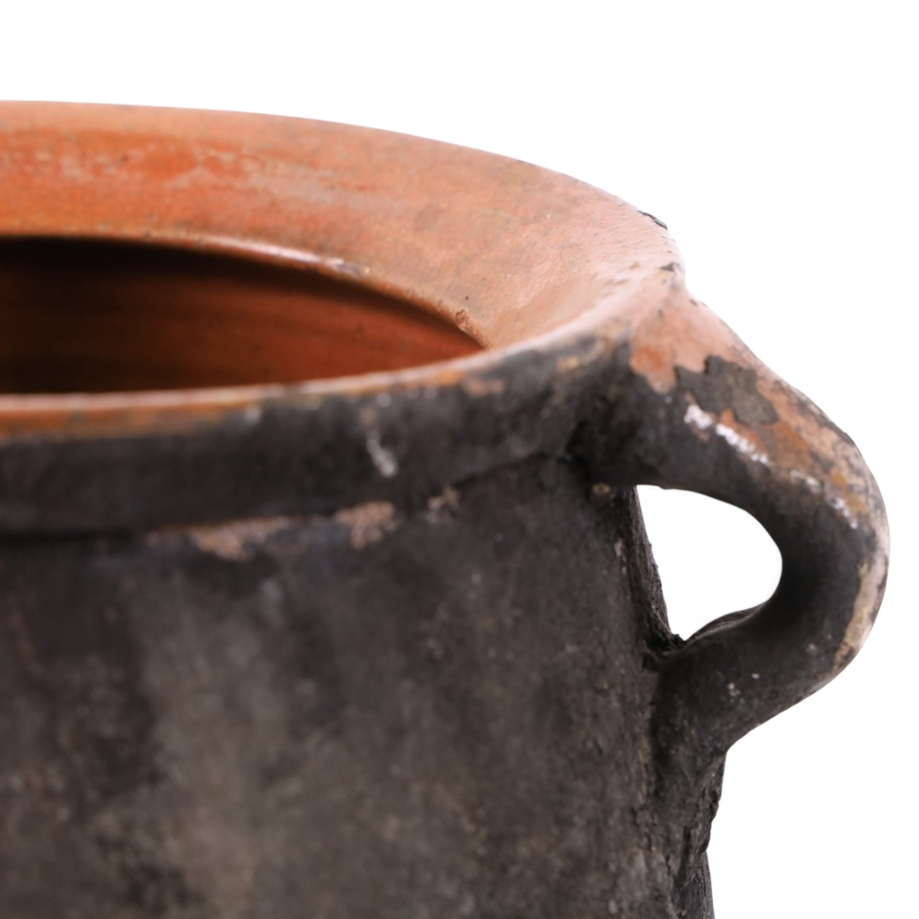 Spanish twin handled cooking pot, blackened to the outside, together with two bowls with slipware glaze, pot H22cm 